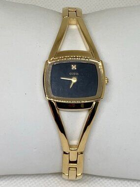 Guess women’s watch gold tone black dial 23mm quartz adjustable links running